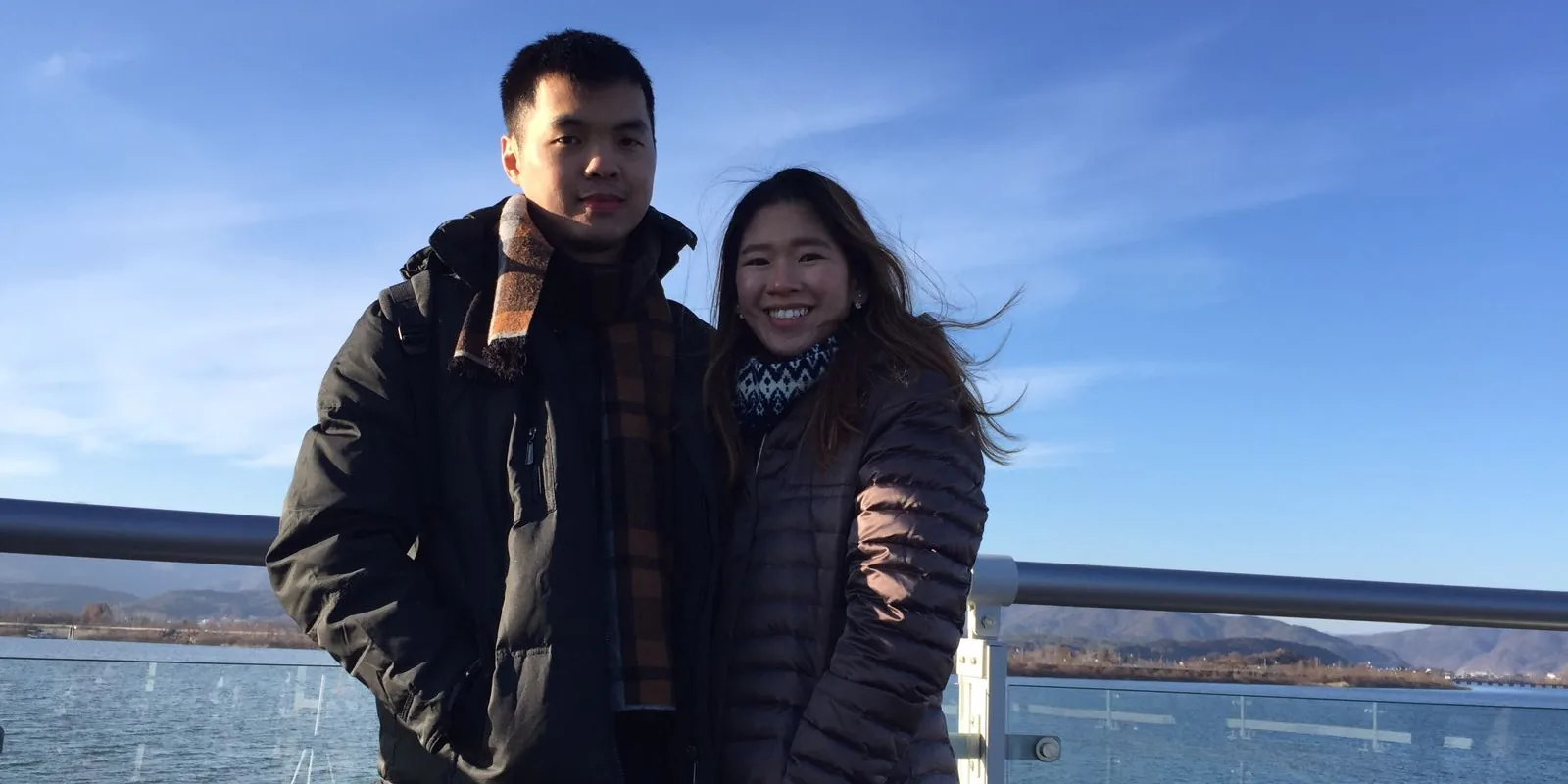 Nicholas and his wife at Soyanggang Skywalk on a clear winter day