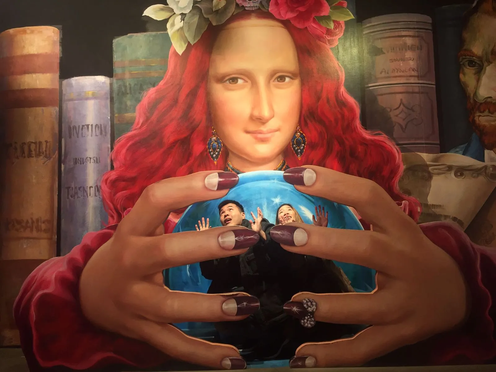 Nicholas and his wife interacting with a Mona Lisa illusion at Trickeye Museum