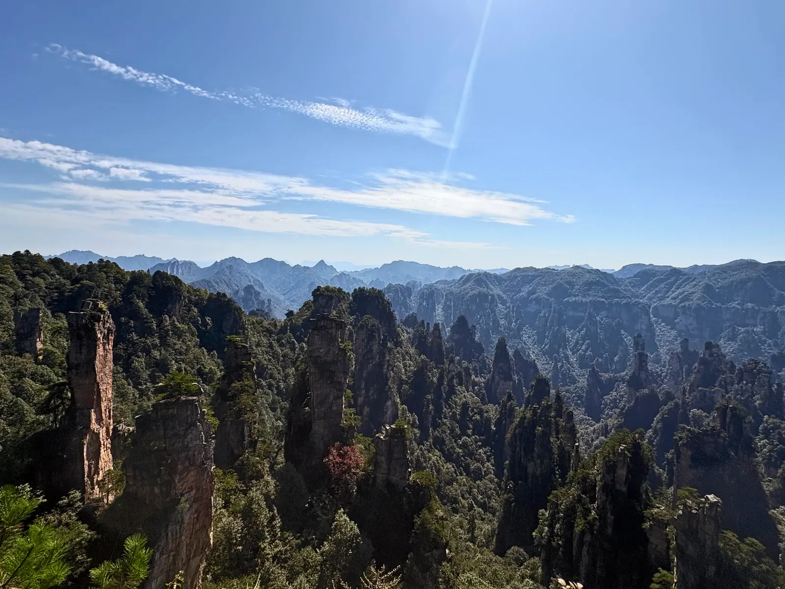 Wide mountain panorama from Tianzi Mountain under a blue sky