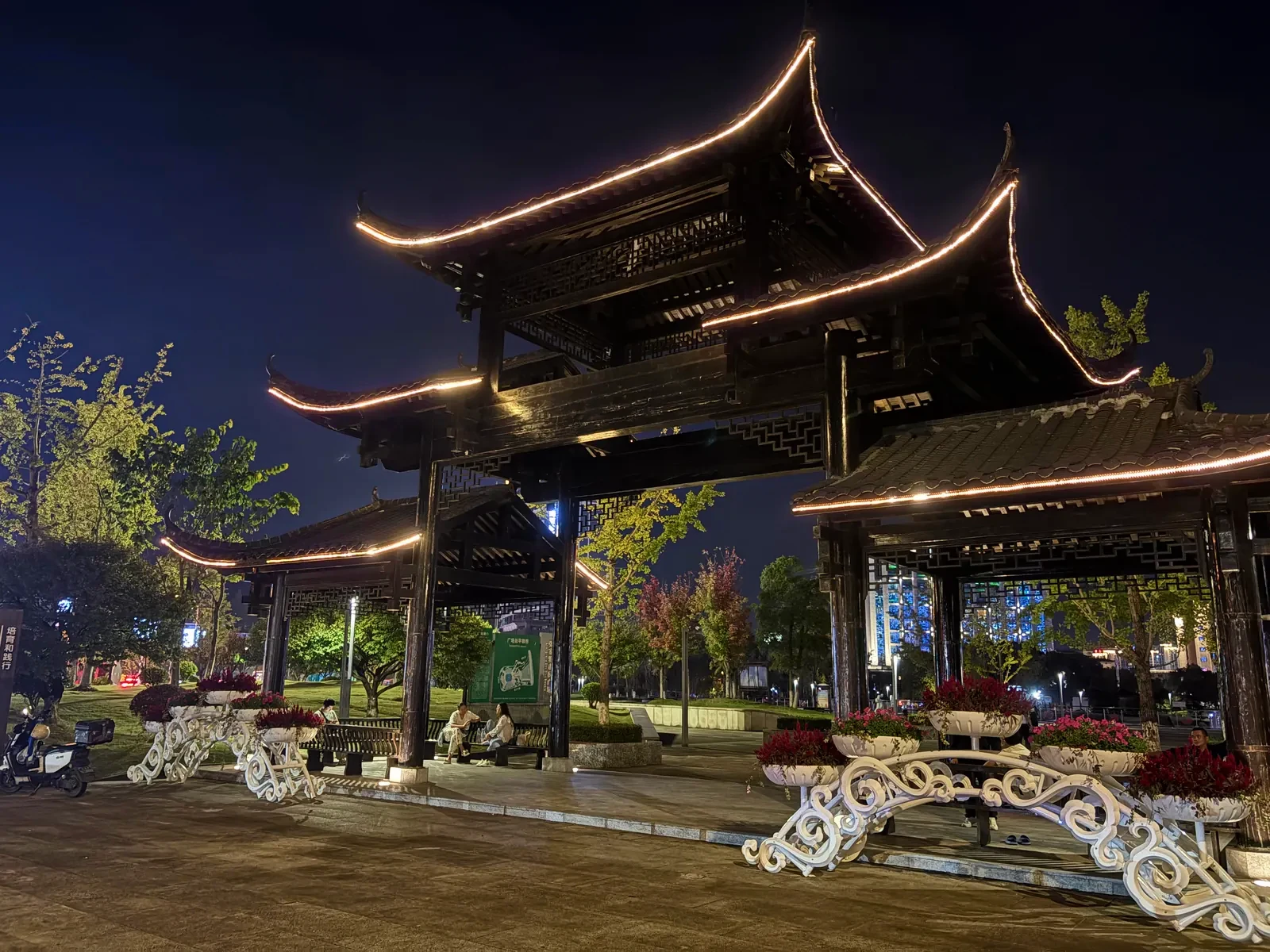 Traditional pavilion on the Zhangjiajie riverfront outlined with warm lights at night