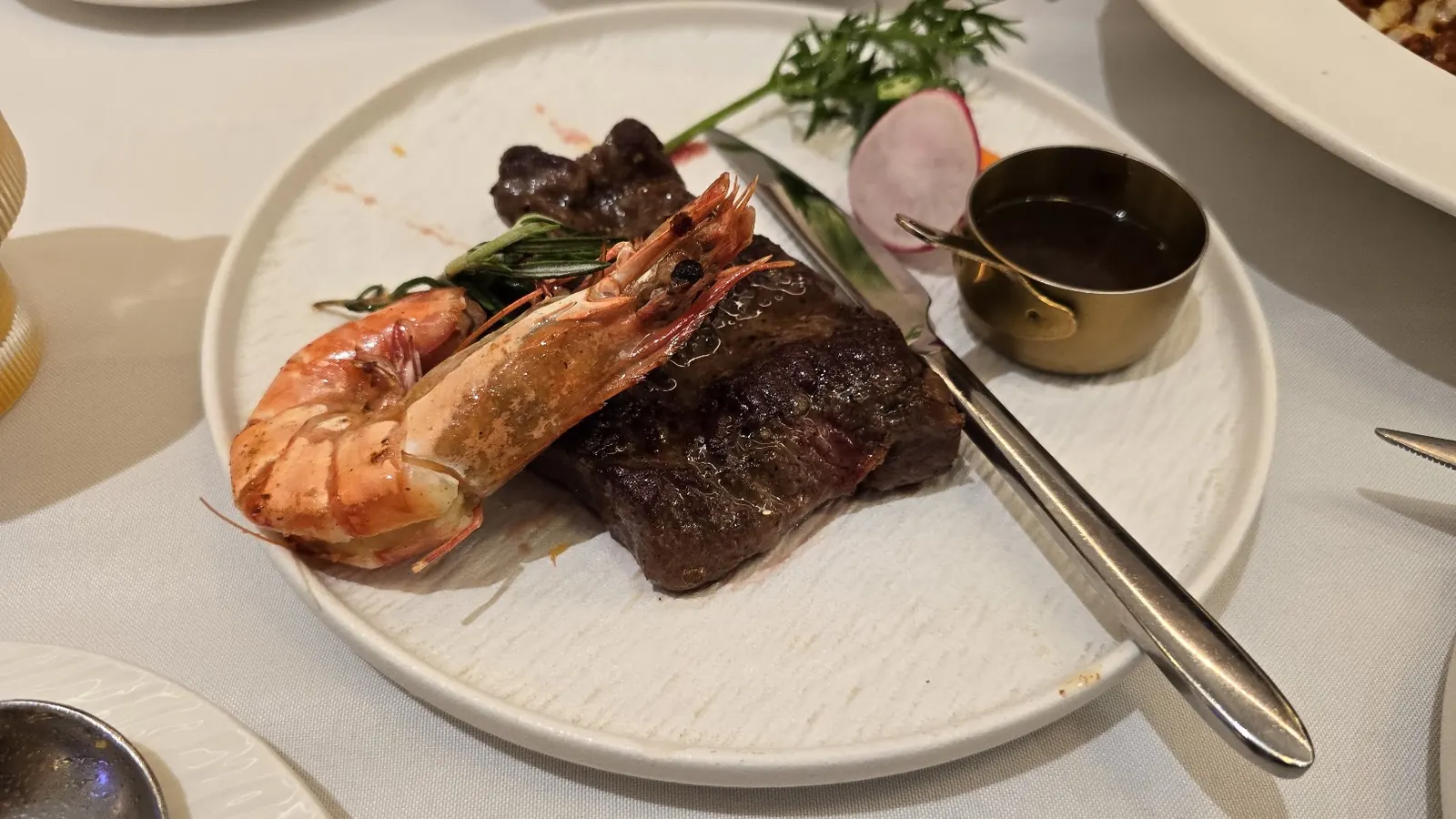 Steak and prawns served for dinner at Green Island Western Restaurant