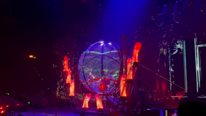 Motorcyclists performing inside a steel globe at Chimelong International Circus